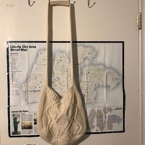 Cream colored knitted bag